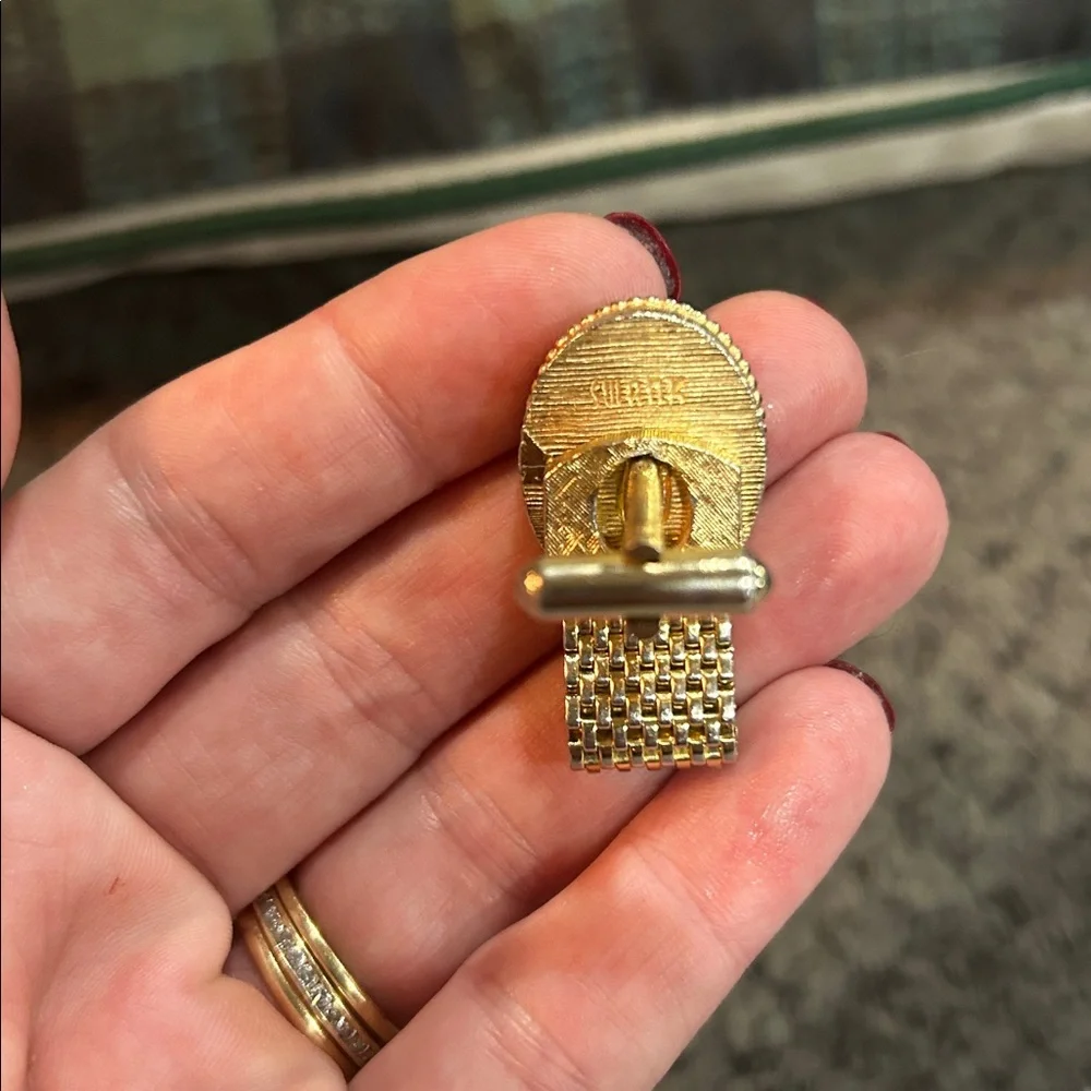 vintage gold-tone woven mesh cufflink with a red rhinestone center.